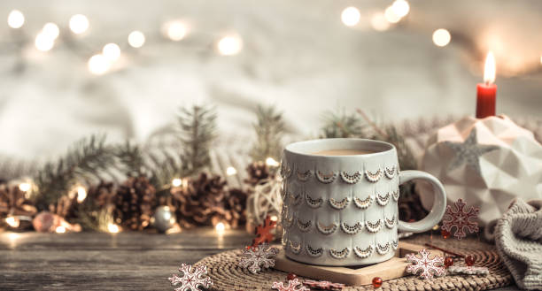istock Festive background with Cup on wooden background with lights. 1194488898