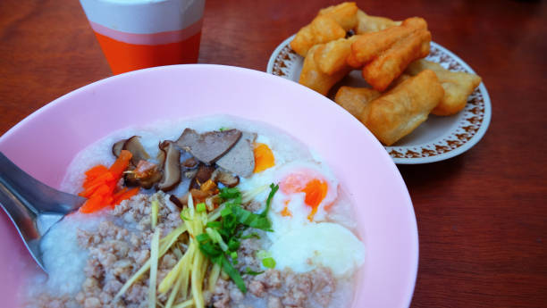 istock Rice porridge, egg, pork ,vegetable and deep fried dough stick for breakfast on the table. 1194489787