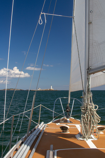 Ocean scenery viewed from the deck of a sailboat.