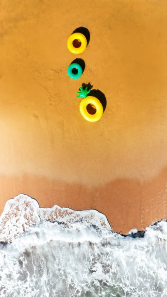 istock Inflatable rings on the beach 1194490277
