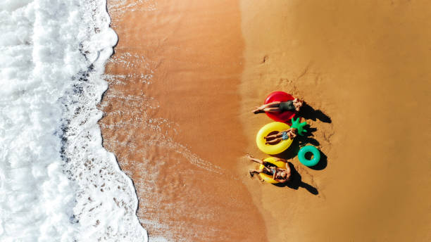 istock Happy family on the beach 1194490384