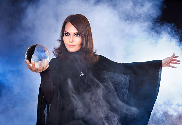 istock Young woman with crystal ball. 119449106