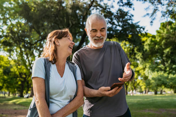 Senior couple checking tracking fitness statistics