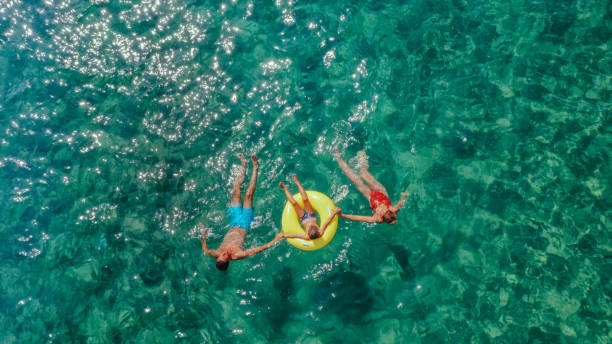 Photo of a happy family having fun in the sea