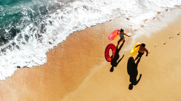 Photo of romantic couple enjoying together in a walk by the sea