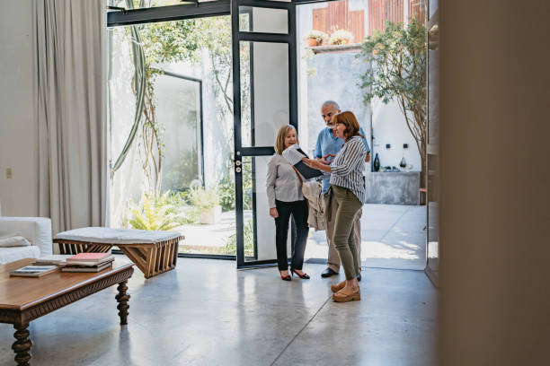 istock Real estate agent and her clients 1194491695