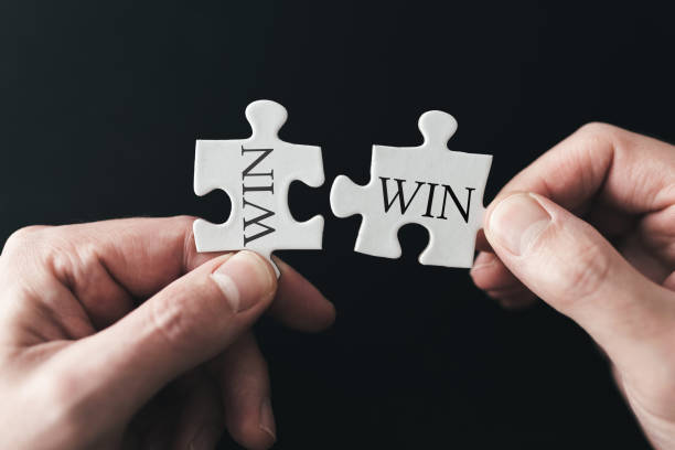 istock win-win situation concept with hands holding puzzle pieces 1194492576
