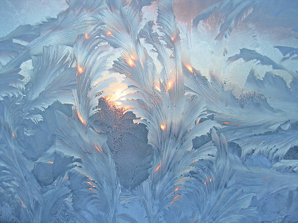 istock Window covered in frost with sunlight shining through 119449294