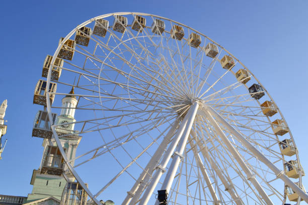 istock Ferris wheel against a blue sky background. 1194493877