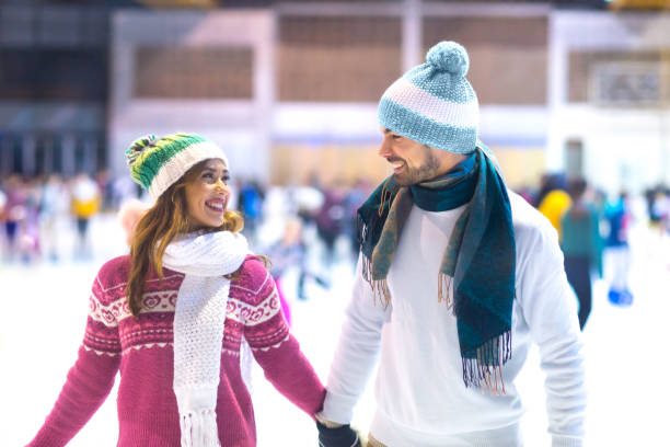 istock Young couple ice skating in winter 1194494480