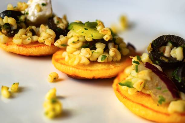 istock Three small pancakes with barley groats,olive and zucchini. 1194498649