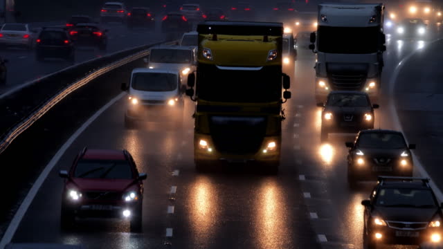 Motorway morning traffic in the rain.