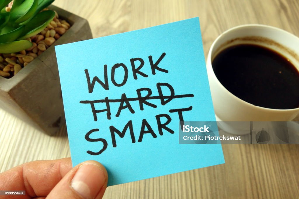 Work smart - motivational reminder handwritten on sticky note Work smart text - motivational reminder handwritten on sticky note Efficiency Stock Photo