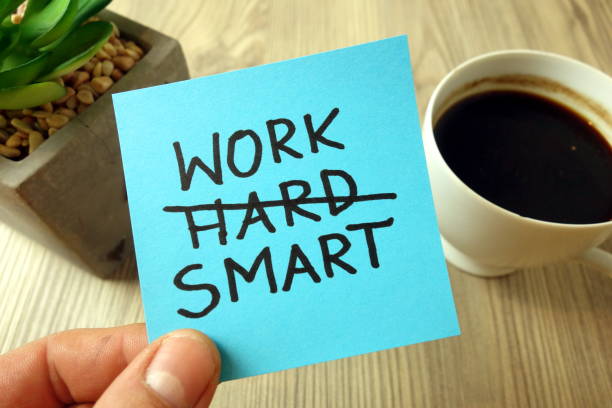 work smart - motivational reminder handwritten on sticky note - tough choices imagens e fotografias de stock