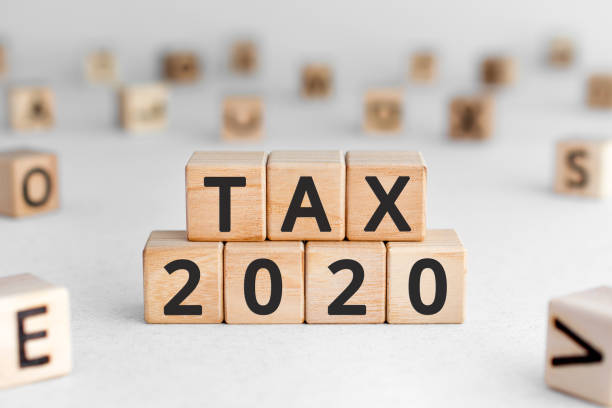istock Tax 2020 - phrase from wooden blocks with letters 1194500849