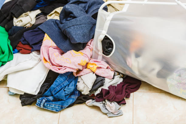istock Basket with many dirty clothes laundry. 1194500927
