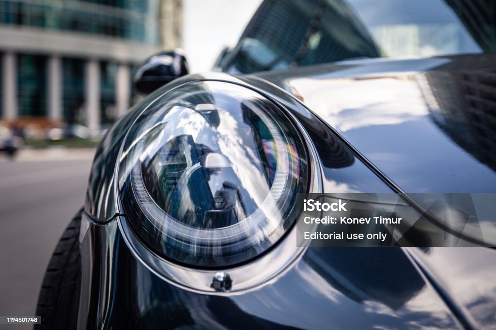Closeup Headlights Of New Shiny Luxury Dark Blue Sports Car Porsche 911  Parked On Street Front Bottom View Sky Reflection On Bonnet Bumper Stock  Photo - Download Image Now - iStock