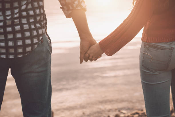 istock Romantic loving couple holding hands 1194502395