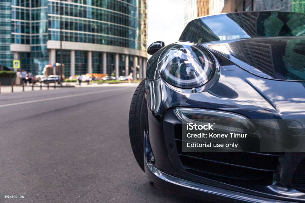 Closeup Headlights Of New Shiny Luxury Dark Blue Sports Car Porsche 911  Parked On Street Front Bottom View Sky Reflection On Bonnet Bumper Stock  Photo - Download Image Now - iStock