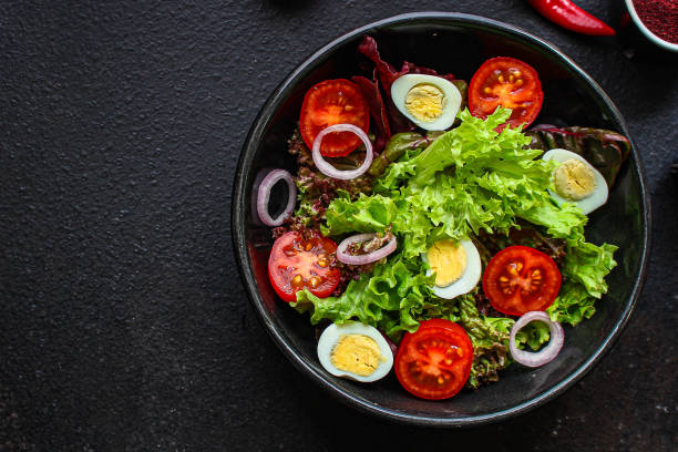 istock healthy salad quail eggs (vegetables, tomato, lettuce and other ingredients) menu concept. food background. top view. copy space 1194502480