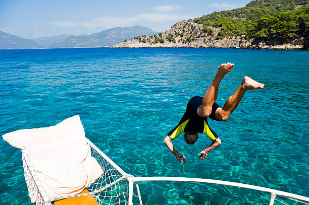 Young Man Diving Into The Sea stock photo