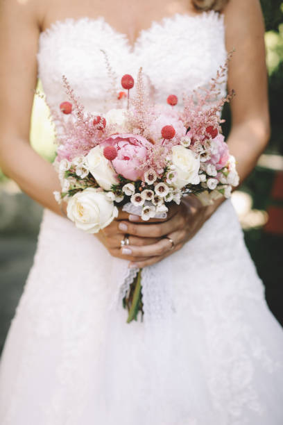 istock The bride holding wedding bouquet 1194503752