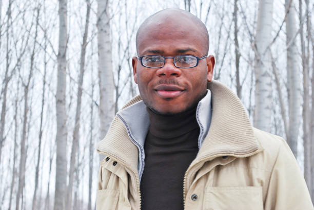istock Male model posing outdoors in the woods 1194503969