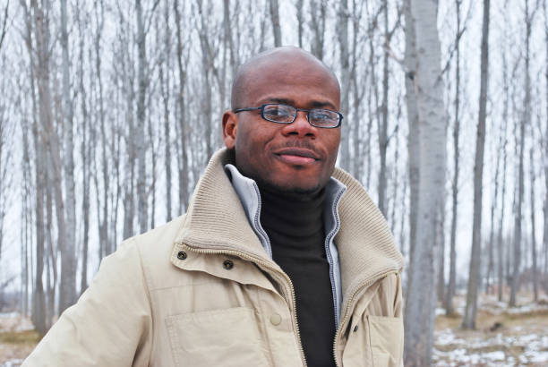 istock Male model posing outdoors in the woods 1194504113