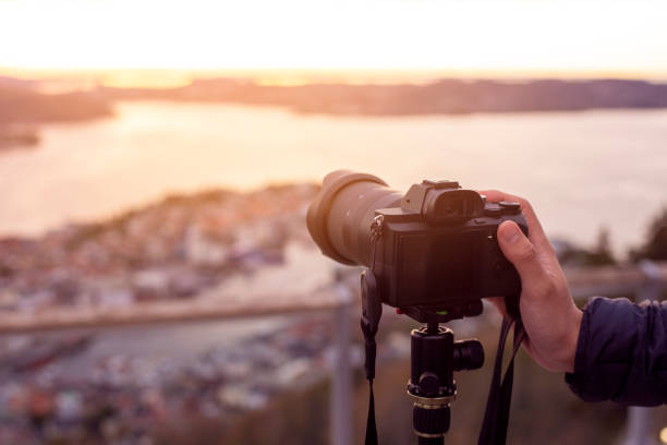 istock A Camera on tripod  is photographing  beautiful view at twilight 1194504253