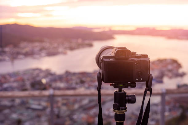 istock A Camera on tripod  is photographing  beautiful view at twilight 1194504265