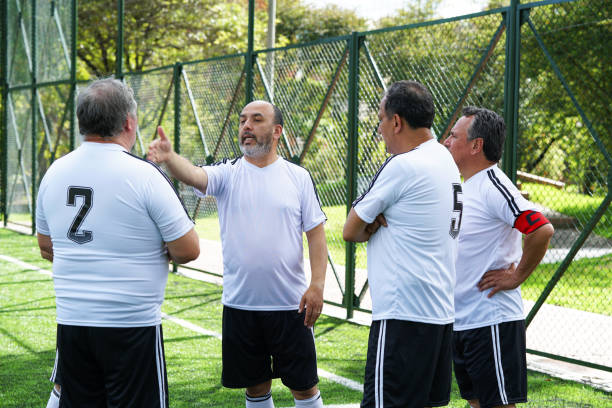 istock soccer players talk about the plays before starting the game 1194505321