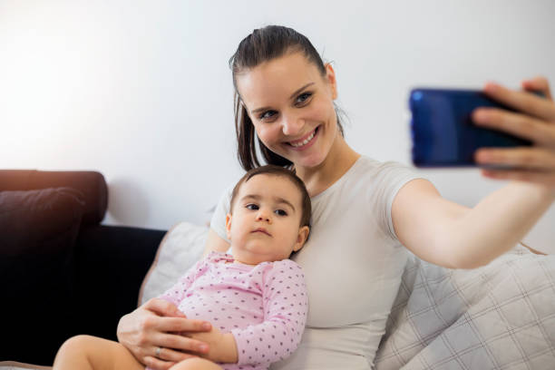 istock Mother playing with her cute baby 1194505397