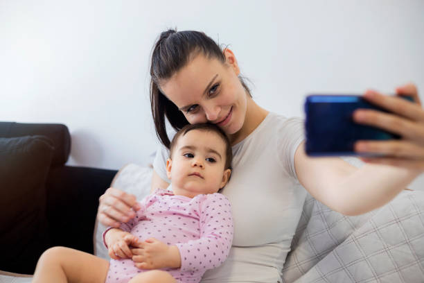 istock Mother playing with her cute baby 1194505430