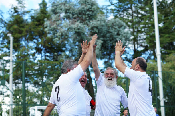 istock gentlemen's soccer team celebrates embraced a goal 1194506616