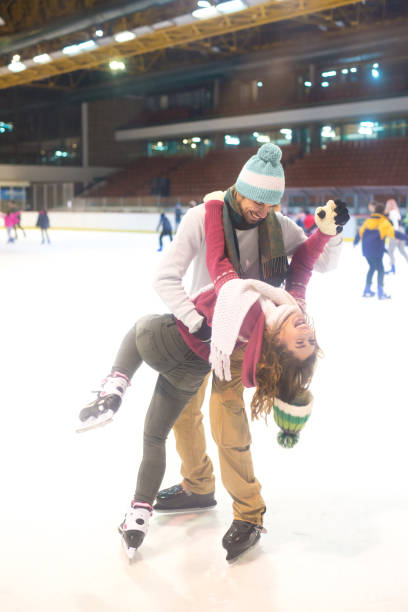 istock Young couple ice skating in winter 1194509092
