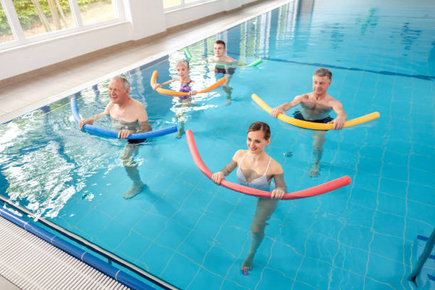 istock Women and men in water exercises during remobilization 1194510003