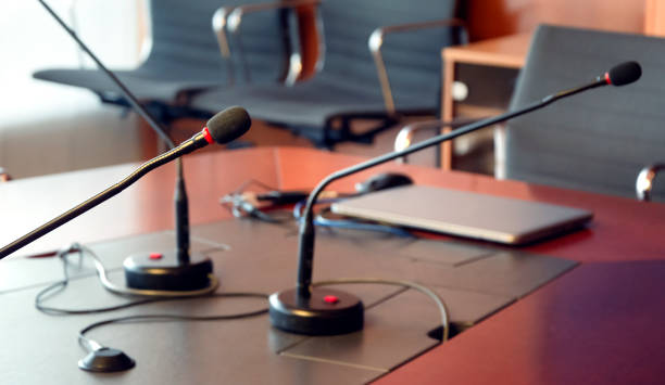 istock microphone on a wooden table of a boardroom 1194511743