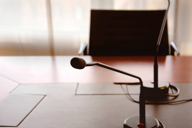 istock microphone on a wooden table of a boardroom 1194513186