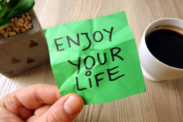 istock Enjoy your life - motivational reminder handwritten on sticky note 1194515476