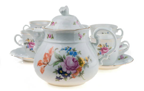 istock Porcelain teapot with cups on a white background. 1194517037