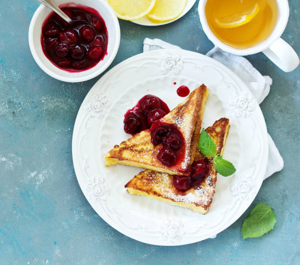 istock French toast with cherry sauce. 1194519562