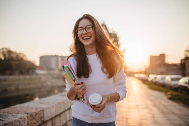istock Beautiful student girl with eyeglasses going home from school 1194522908