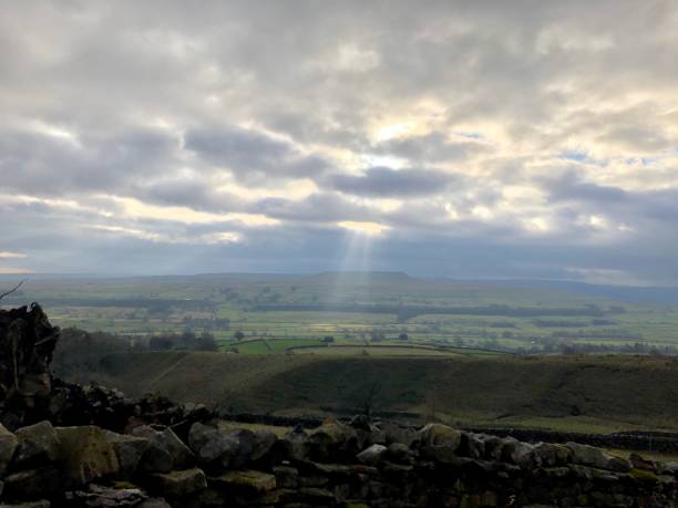 Shafts of sunlight from a cloudy sky over Yorkshire stock photo