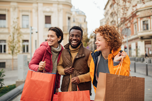 Three friends on a vacation, using an opportunity to shop for Christmas and a new year's presents