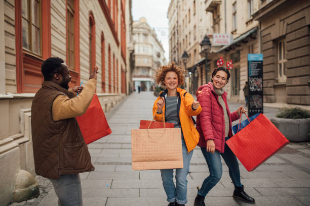 istock Three beautiful people shopping for Christmas 1194525633