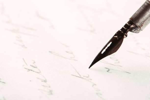 istock fountain pen on paper with ink text closeup 1194525852