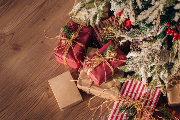 istock Christmas and New Year decorations with lights.Christmas tree and gift boxes left by santa claus 1194525885