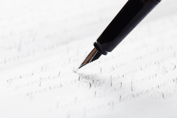 istock fountain pen on paper with ink text closeup 1194525929