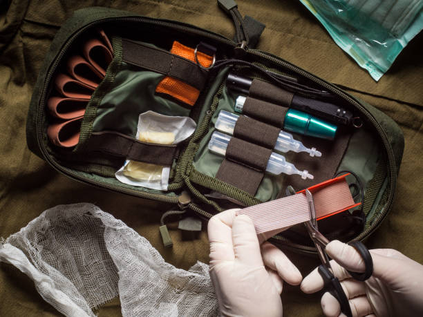 istock Medical tape cutting during first aid in an emergency 1194526859