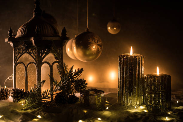 istock Creative artwork decoration. Christmas decoration with burning candles on a dark background. Christmas ornaments over dark golden background with lights. 1194528797
